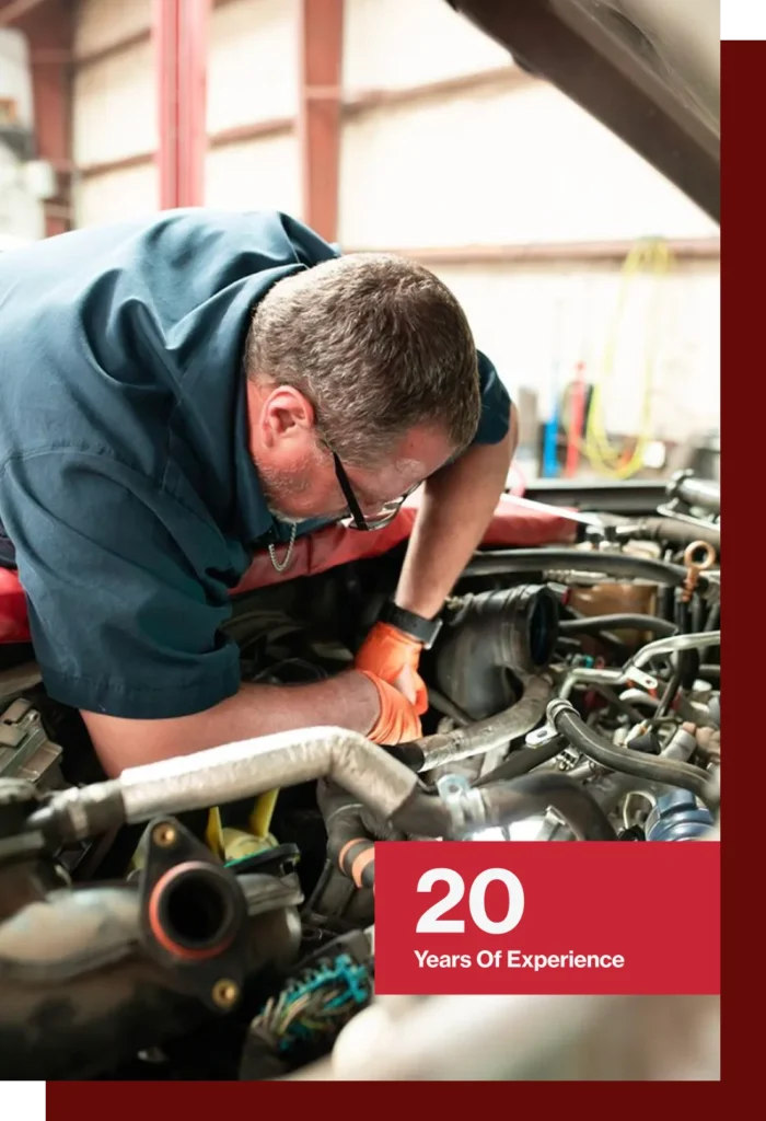 Diesel technician repairing a diesel pickup truck at Diesel Pros in Hurst, TX