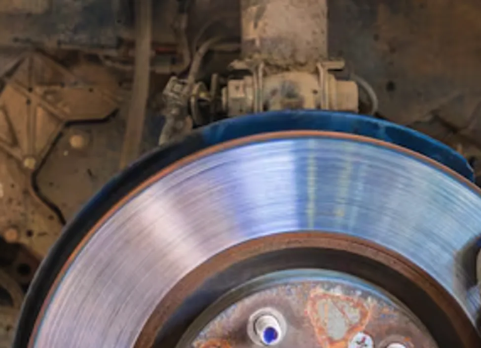 Close-up of a diesel truck brake rotor and caliper during brake service