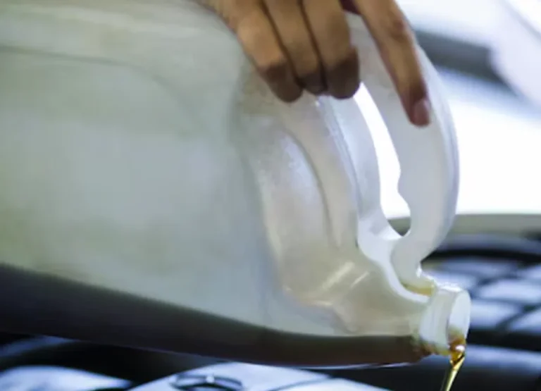 Fresh oil being poured during a diesel truck oil change